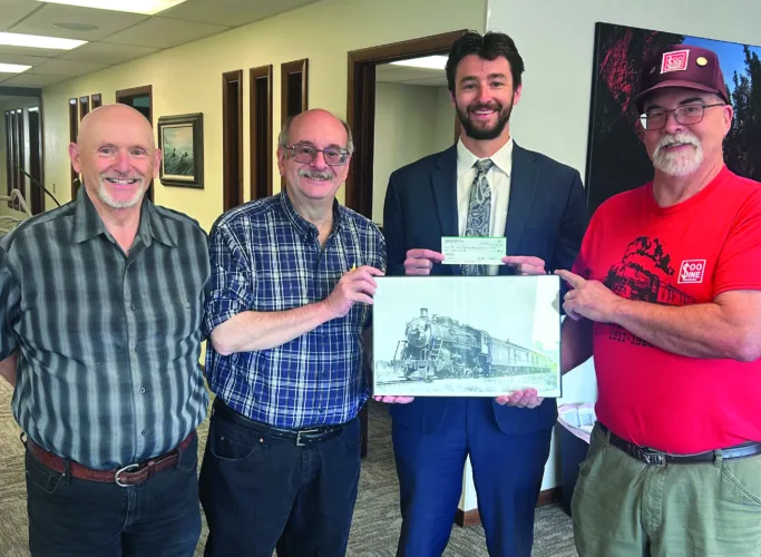 Gladstone Lions donate $500 to the Michigan Soo Line Steam Engine #730 Authority